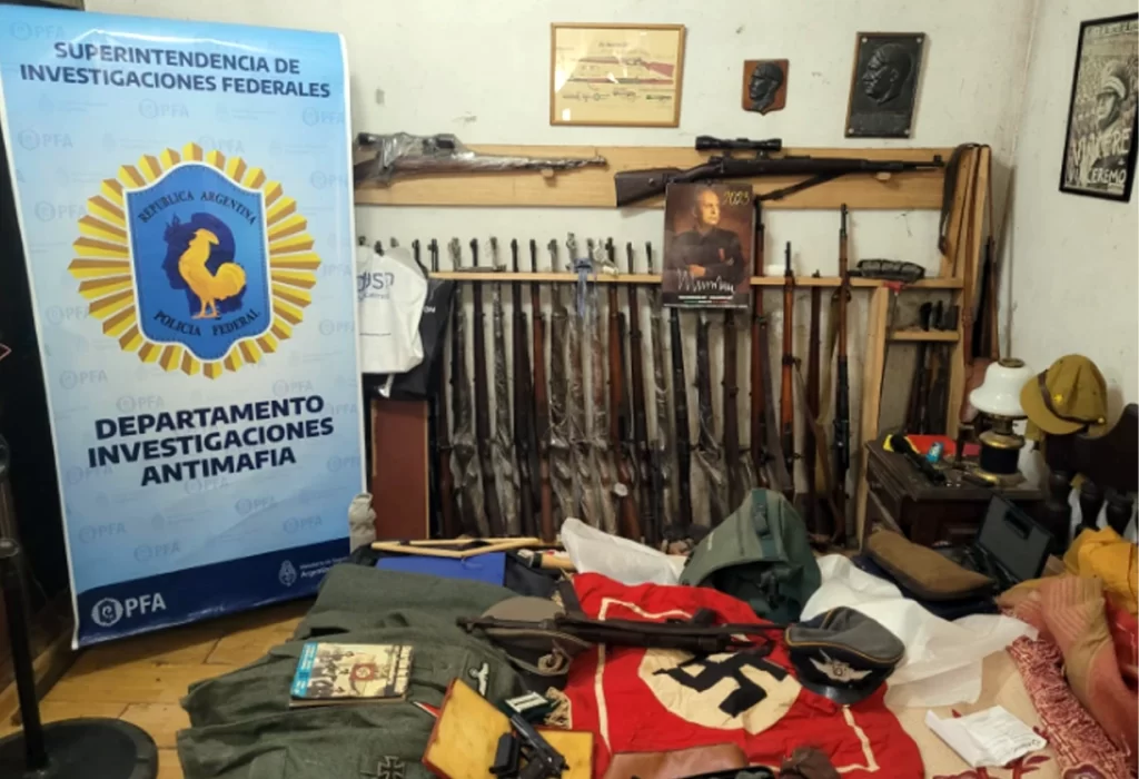 Incautación de armas y símbolos nazis en Quilmes: un detenido en operación internacional